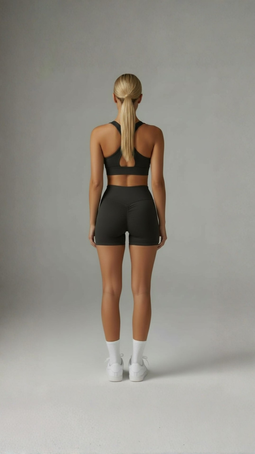 AIRE Sculpt+ Scrunch-Bum Shorts in black, fitted athletic shorts with a contoured scrunch detail for shaping and support.